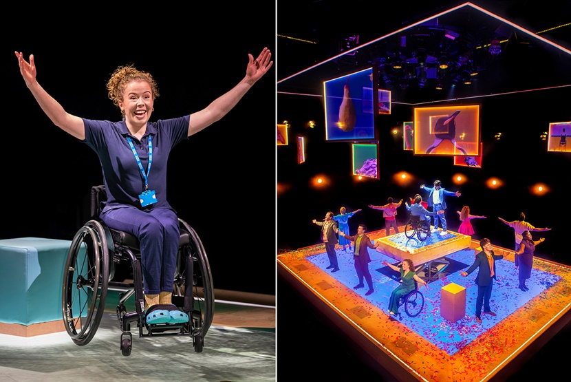 Wheelchair user and actor Amy Trigg smiles and raises her hands in a scene from “The Little Big Things.”
A faraway view of the cast performing “The Little Big Things” onstage in London, with Amy Trigg and Ed Larkin in wheelchairs.