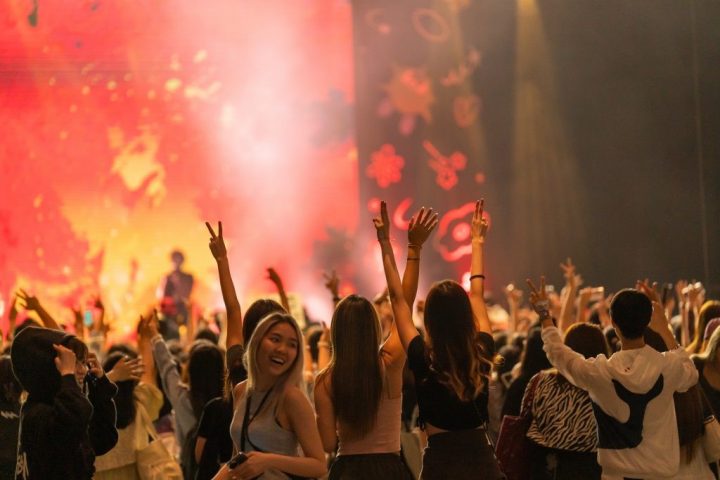 Attendees enjoying the club-like atmosphere of the performances