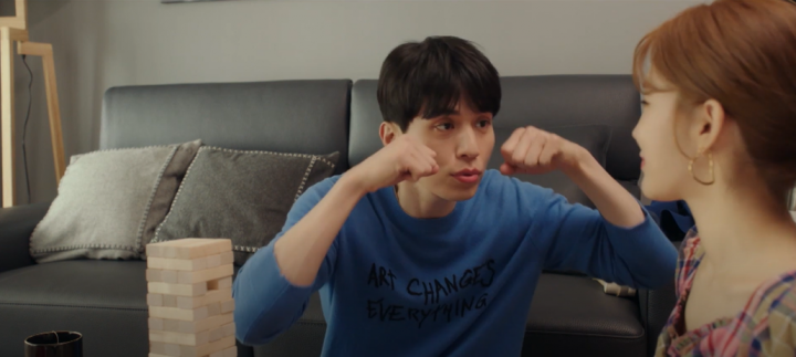 image of a Asian man acting cute showing aegyo to his girlfriend