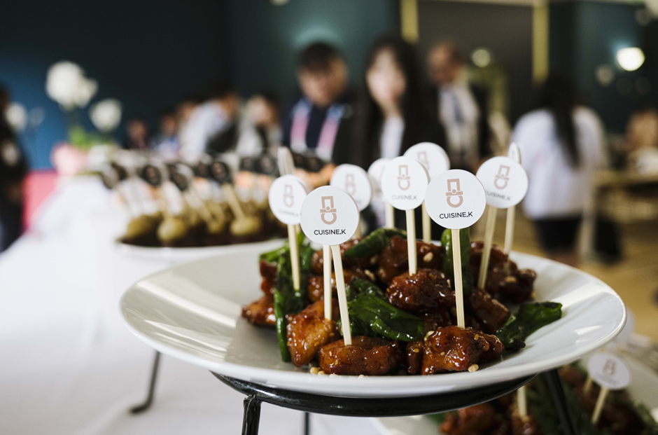 crunchy chicken glazed in special sauce on top of white plate
