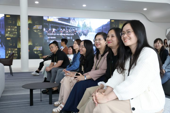 Close up image of CJ ENM Studio Center tour participants 