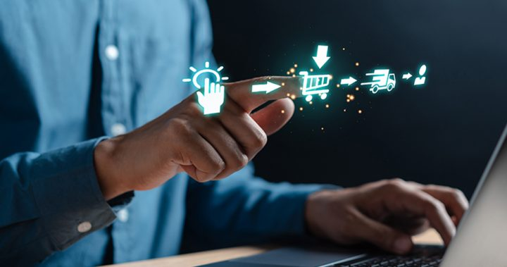A man poking at a holographic cart with the ecommerce process on the left and right. 
