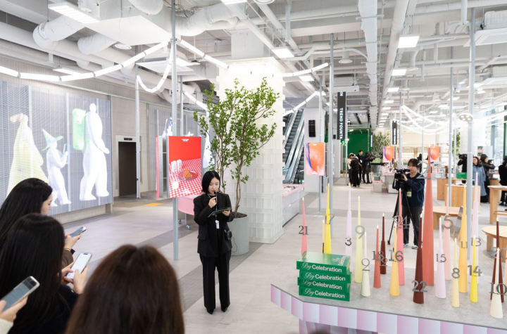 CJ Olive Young presenting on the tour of the store space at Olive Young N Seongsu.
