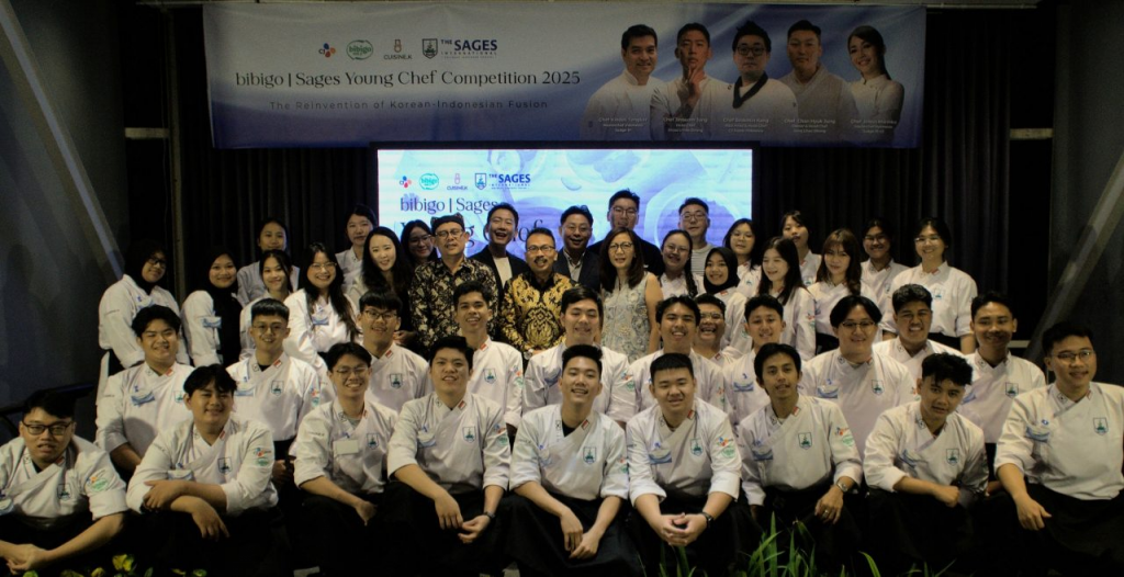 The cohort of bibigo x Sages Young Chef Competition 2025, wearing white chefs’ uniforms.