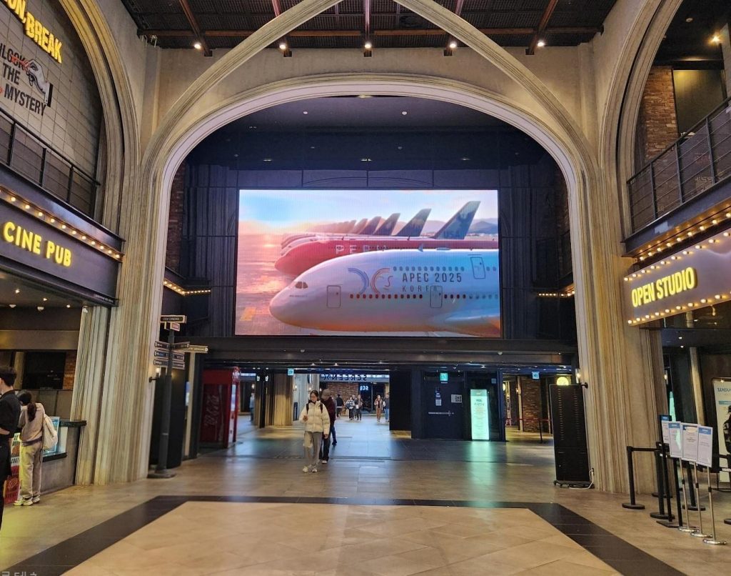 APEC 2025 advertisement displayed at CGV lobby in Yongsan I'PARK Mall