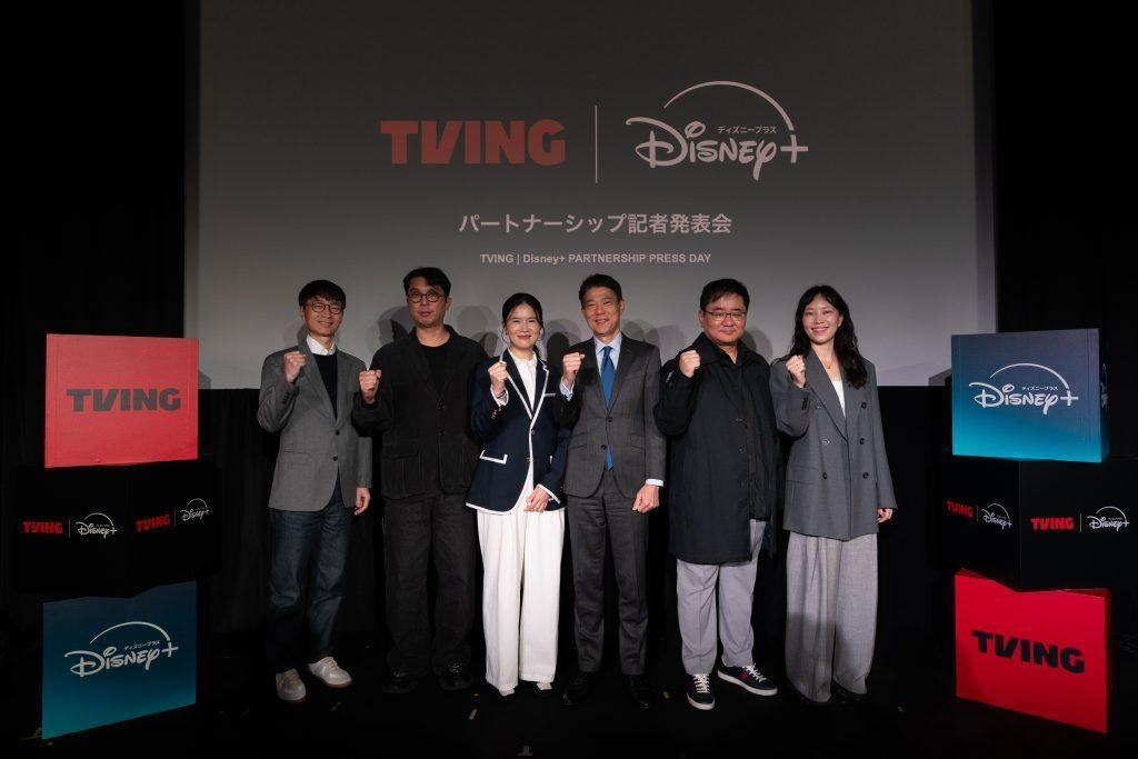 Representatives from TVING and Disney+ pose at a promotional event for their partnership.