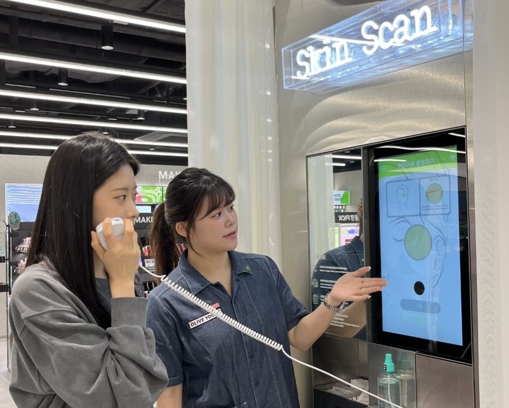 Customer trying out the Olive Young Skin Scan Pro” service