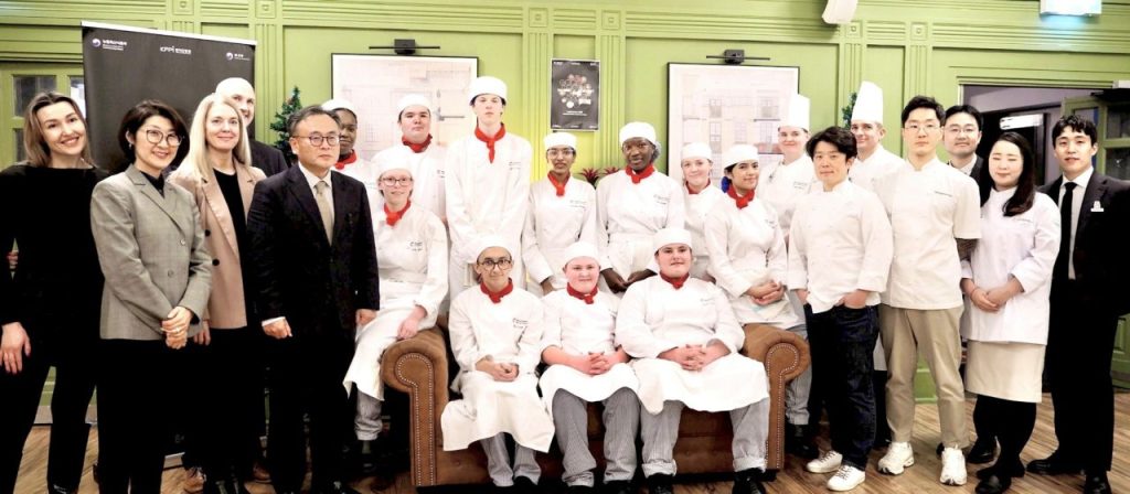 The young chefs and judges of the Hansik Contest pose for a photo at the Vincent Rooms at Capital City College.