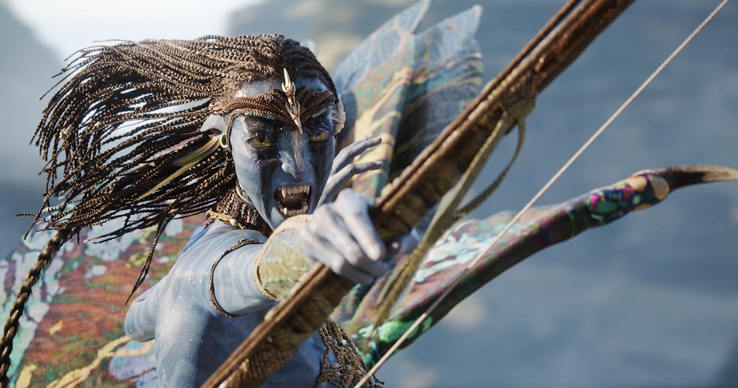 A still image from “Avatar: Fire and Ash” showing Neytiri shooting a crossbow.