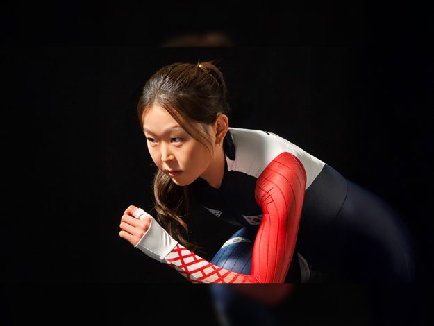 Kim Min-sun poses in a speed skating uniform.