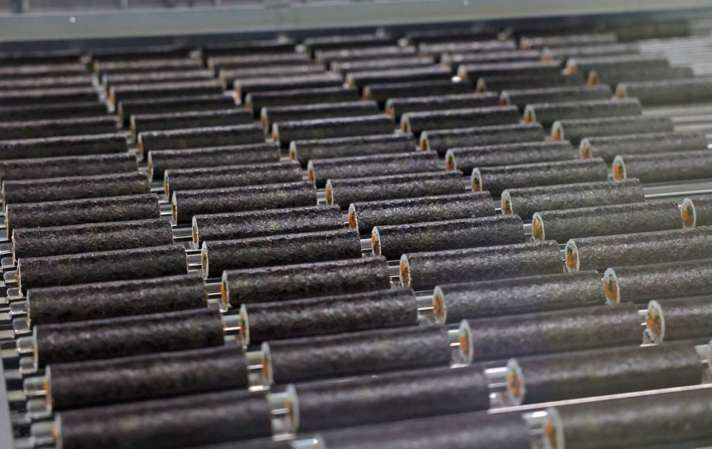 Rows of frozen gimbap on a production line at CJ Blossom Campus