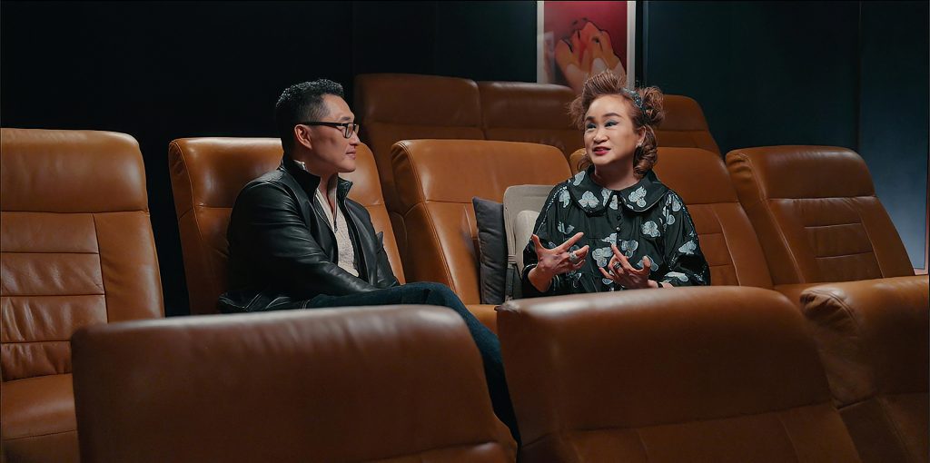 Daniel Dae Kim and CJ Group Vice Chairwoman Miky Lee sit in a theater as they discuss Korean culture and entertainment in CNN Original Series “K-Everything.”