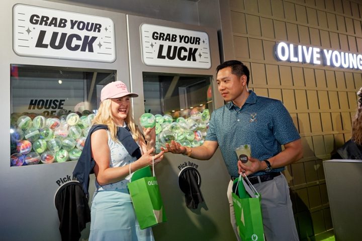 Visitors carry OLIVE YOUNG shopping bags at THE CJ CUP Byron Nelson.