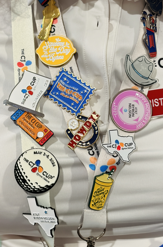 A volunteer’s pin-covered lanyard at THE CJ CUP Byron Nelson reflects years of tournament history.