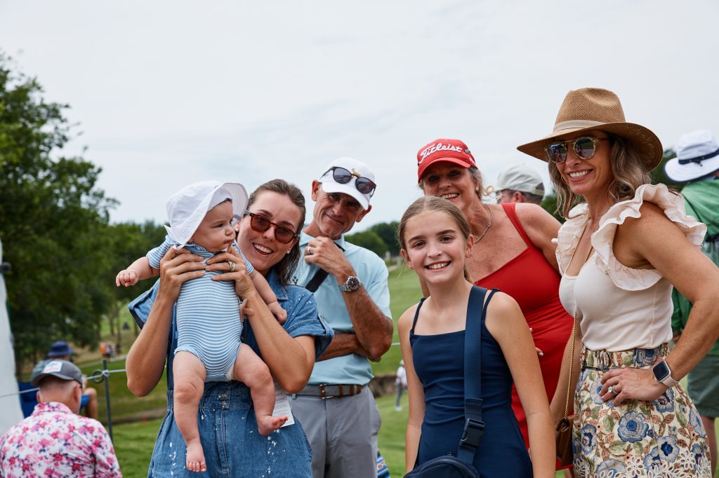A family poses for a photo at THE CJ CUP Byron Nelson.