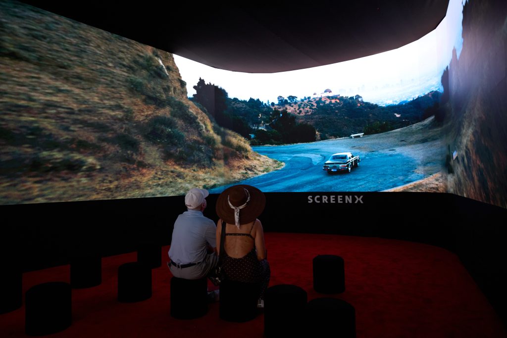 Visitors watch the immersive SCREENX experience at THE CJ CUP Byron Nelson.