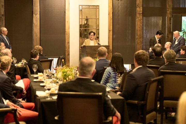 CJ Group Chairman Lee Jay-hyun speaks at a podium to a room filled with people.