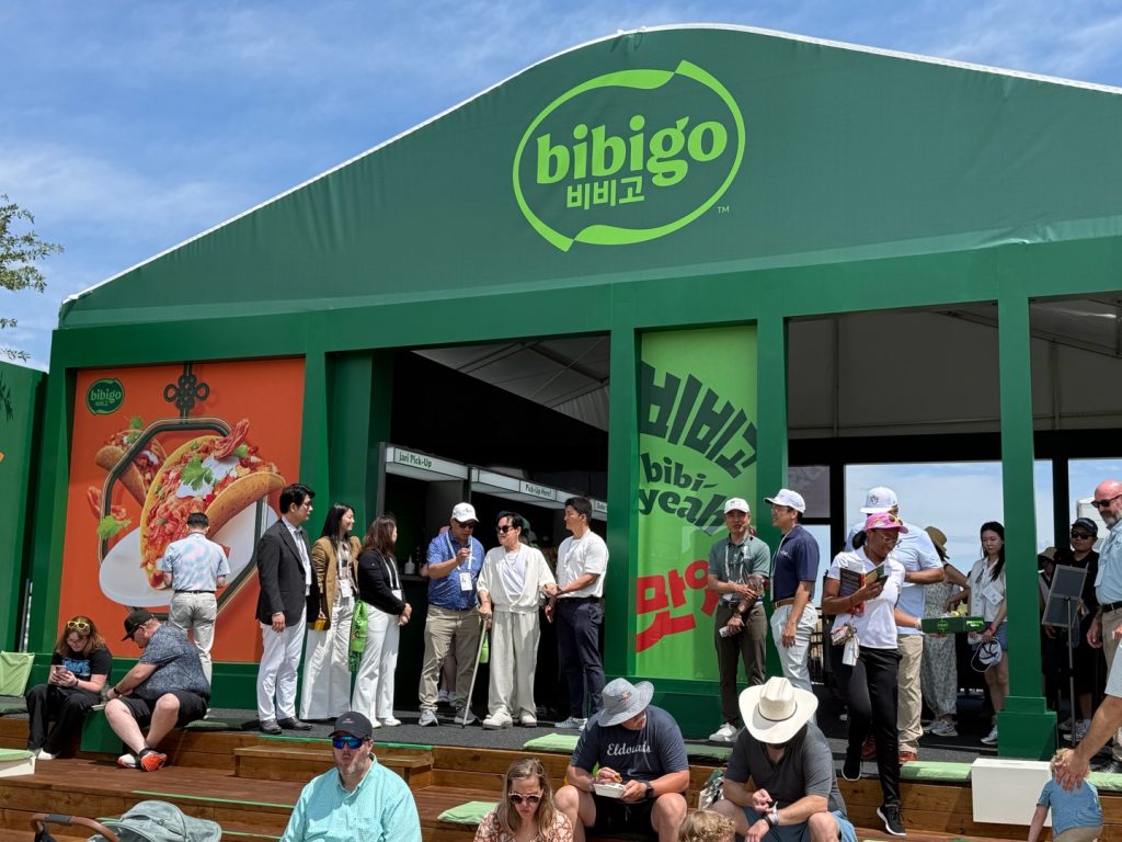 CJ Group Chairman Lee Jay-hyun tours the bibigo booth inside House of CJ at THE CJ CUP Byron Nelson.
