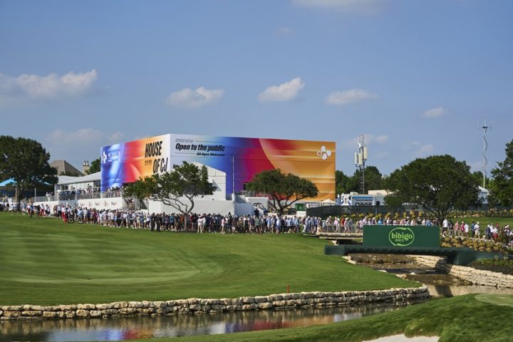 A wide view of House of CJ surrounded by visitors, with a bibigo sign in the foreground.