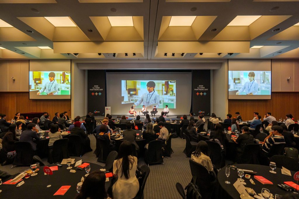 A packed audience watches a panel discussion at 2026 CJ ENM Partners Day in Seoul.