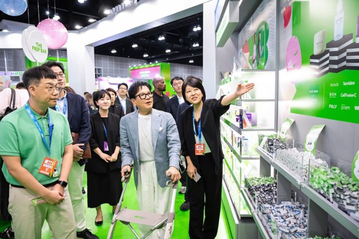 CJ Chairman Lee Jay-hyun looks at the K-beauty products at OLIVE YOUNG FESTA during KCON LA 2026.
