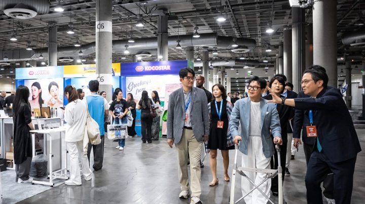 CJ Chairman Lee Jay-hyun looks at products in the K-Collection zone at KCON LA 2026.