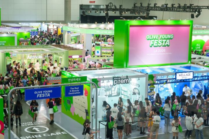 An overview shot of OLIVE YOUNG FESTA showing hundreds of visitors and several pop-up stores.