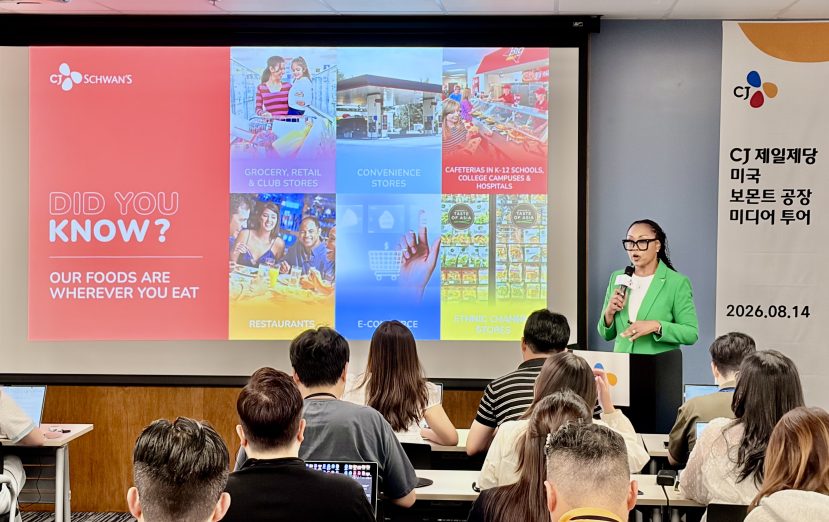 A woman gives a presentation with the title, “DID YOU KNOW?” and the subtitle, “Our Foods are Wherever You Eat.”