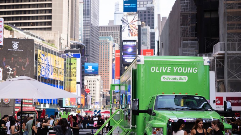 OLIVE YOUNG’s K-Beauty Edit pop-up draws visitors in New York’s Times Square.