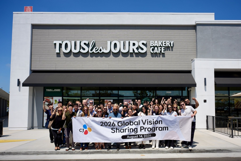 CJ employees pose for a group photo outside TOUS les JOURS La Habra.