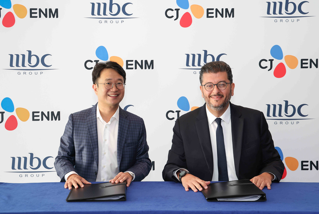 Sebastian Kim (left) of CJ ENM and Tareq Alibrahim of MBC GROUP sign a strategic partnership to expand K-content across MENA.